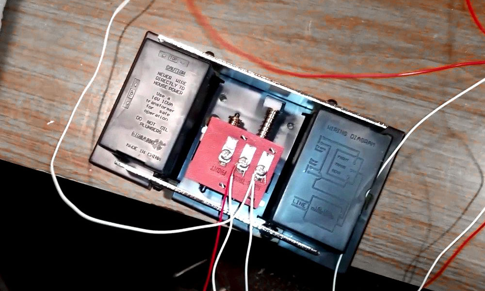 Doorbell with molded in wiring diagram. Credit: Wiring a Doorbell by 33 Electric (<a href='https://www.youtube.com/watch?v=9gMsCdNRTVY'>Youtube</a>)