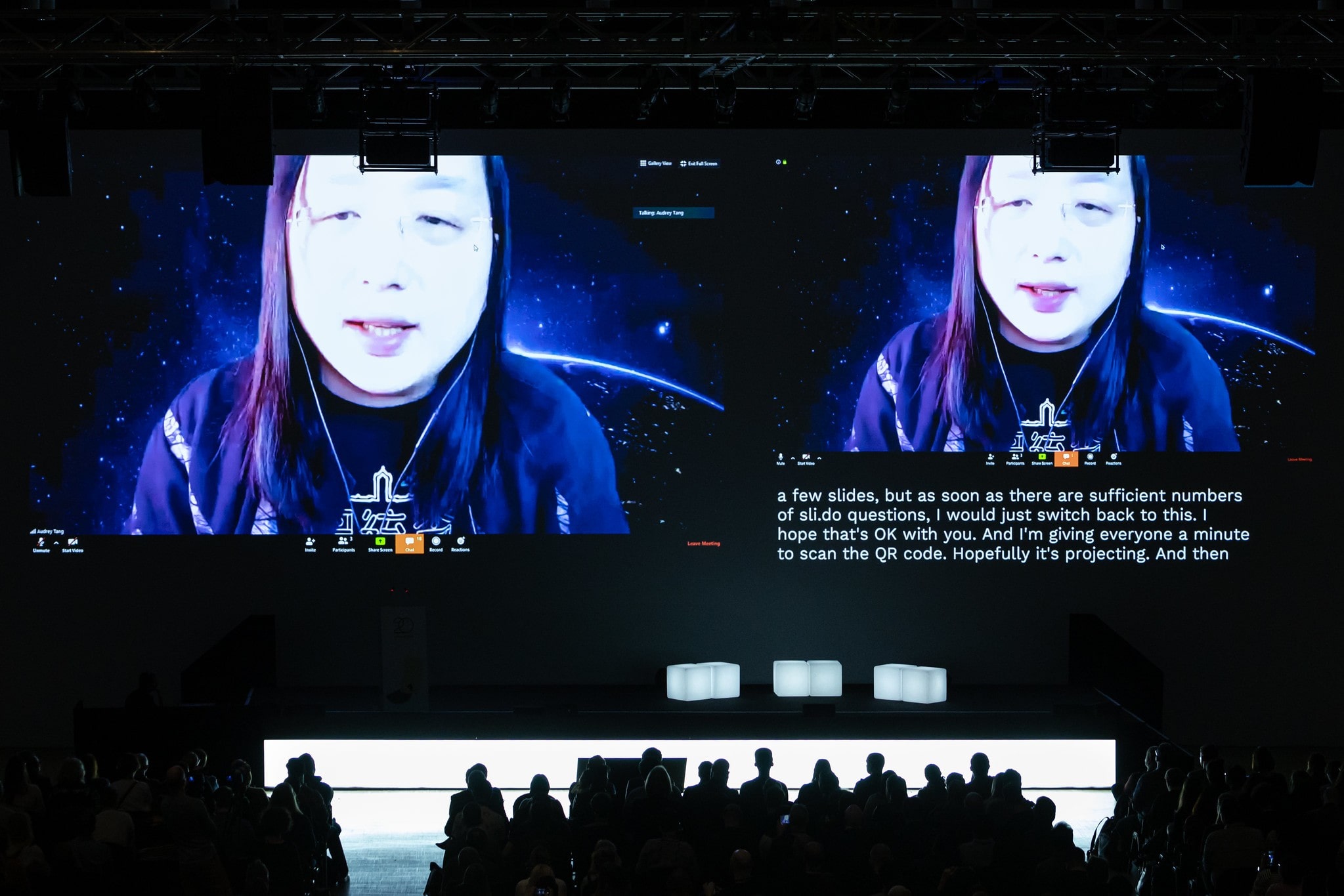 Audrey Tang on stage via video link